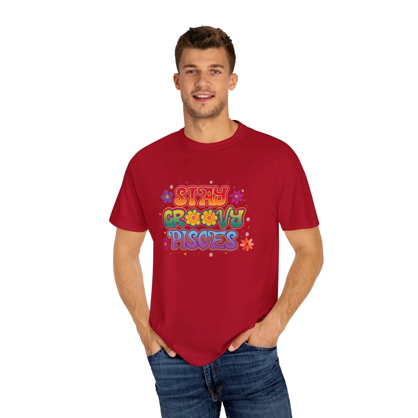 Smiling man wearing red t-shirt with colorful Stay Groovy Pisces graphic and floral designs